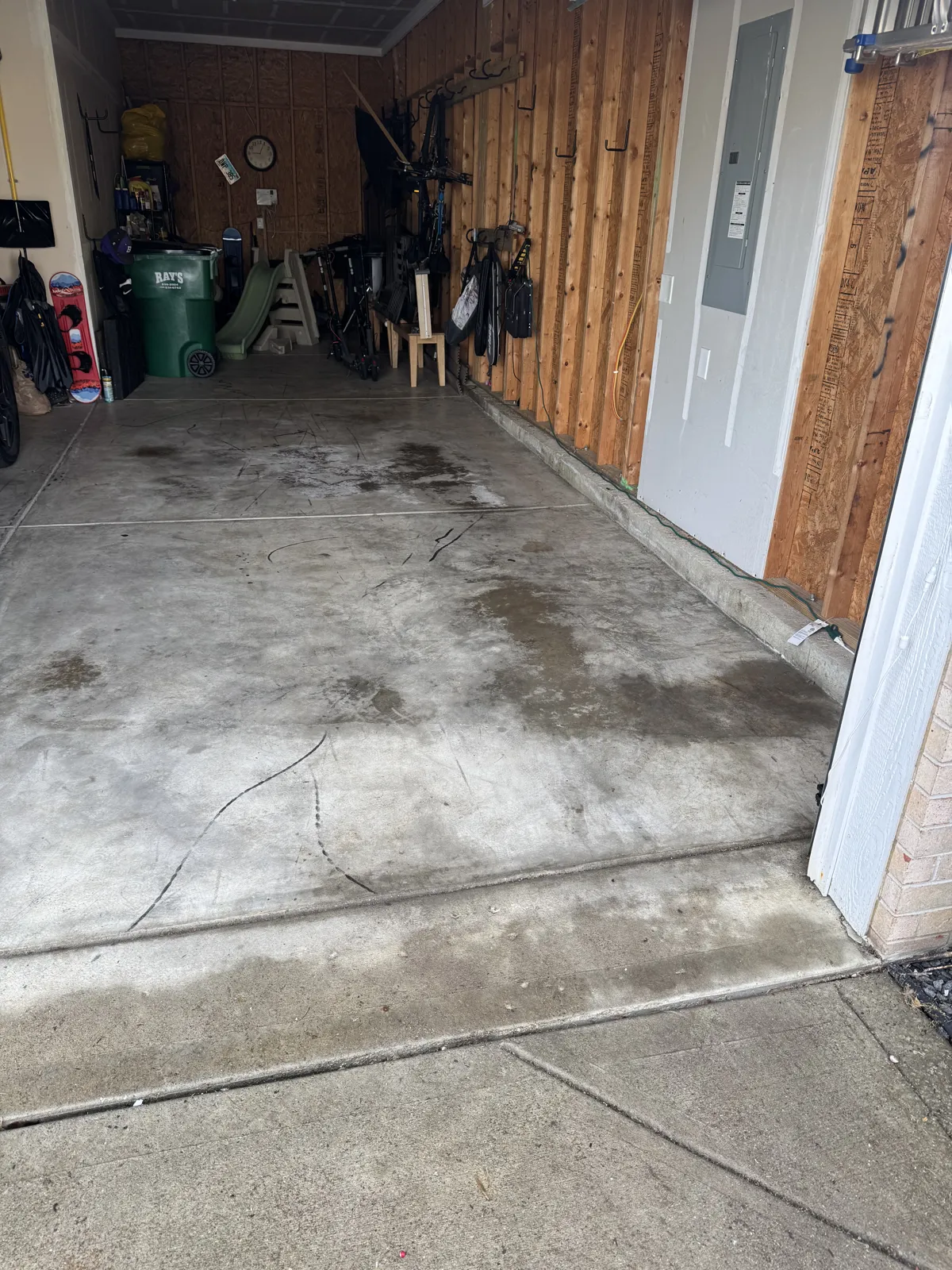 Same wood-paneled garage emptied